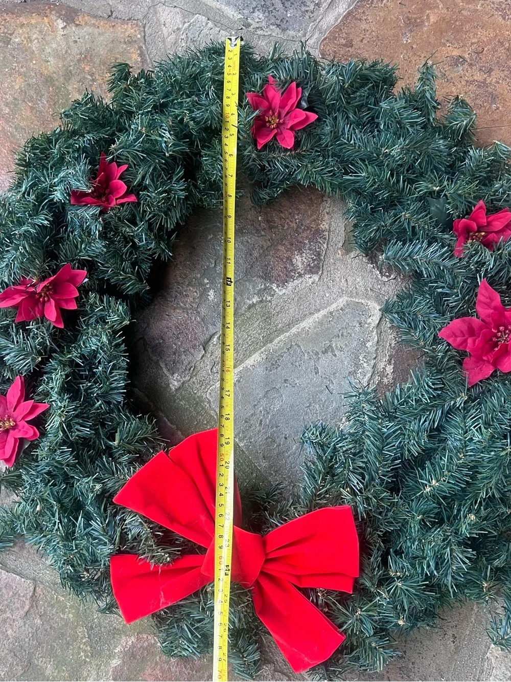 Festive Green Holiday Wreath with Red Bow and Poinsettias